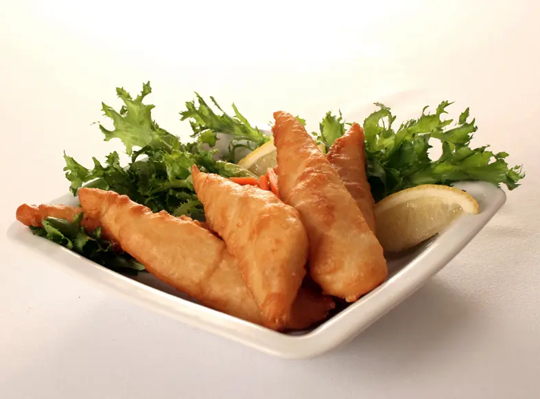 Golden battered flathead tails with salad and lemon