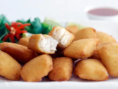 Golden flake bites on a white plate