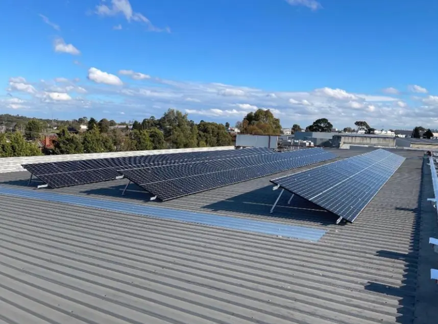 Solar panels mounted on manufacturing facility rooftop