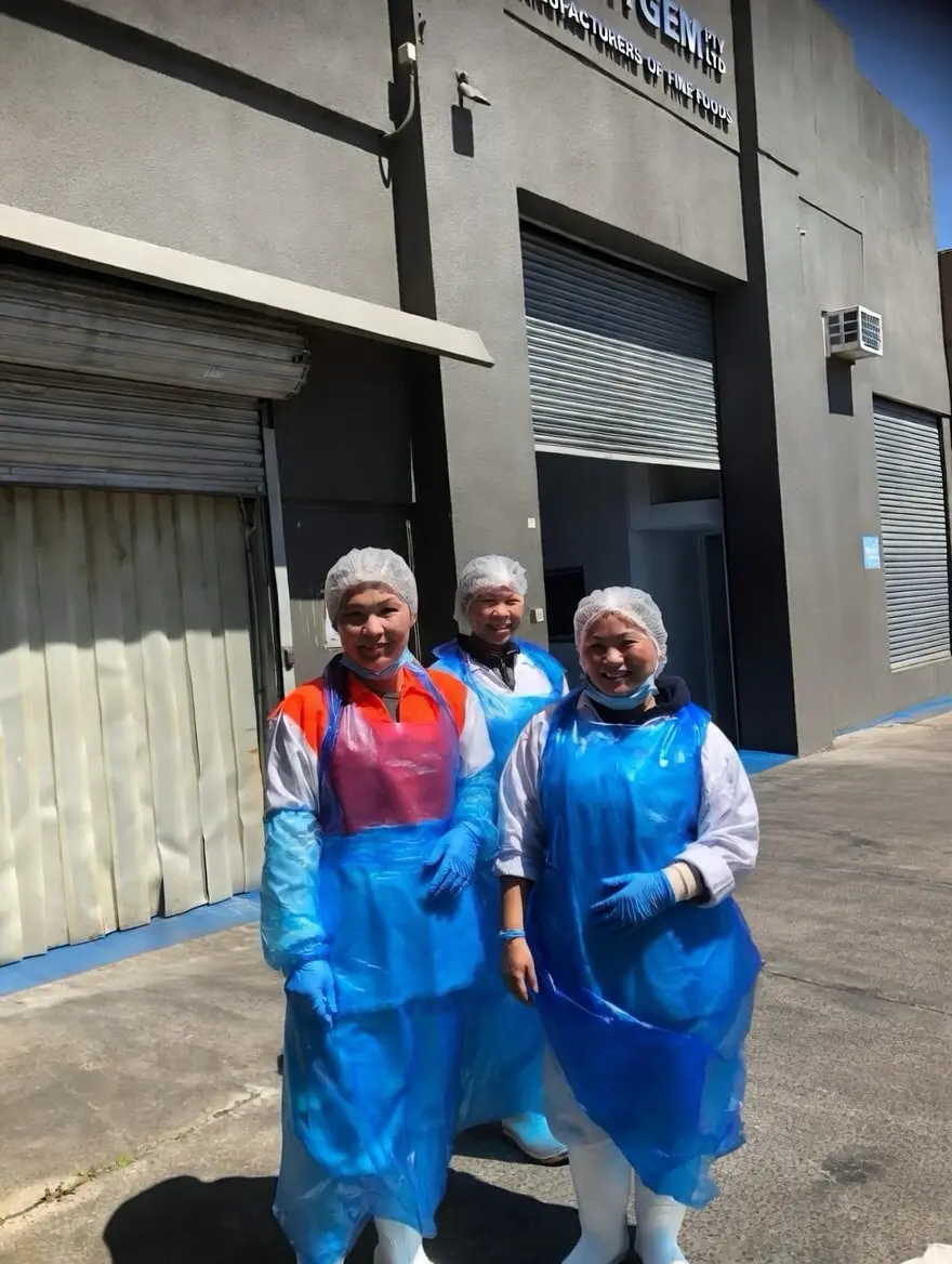 Three team members outside the Courtgem Pty Ltd facility
