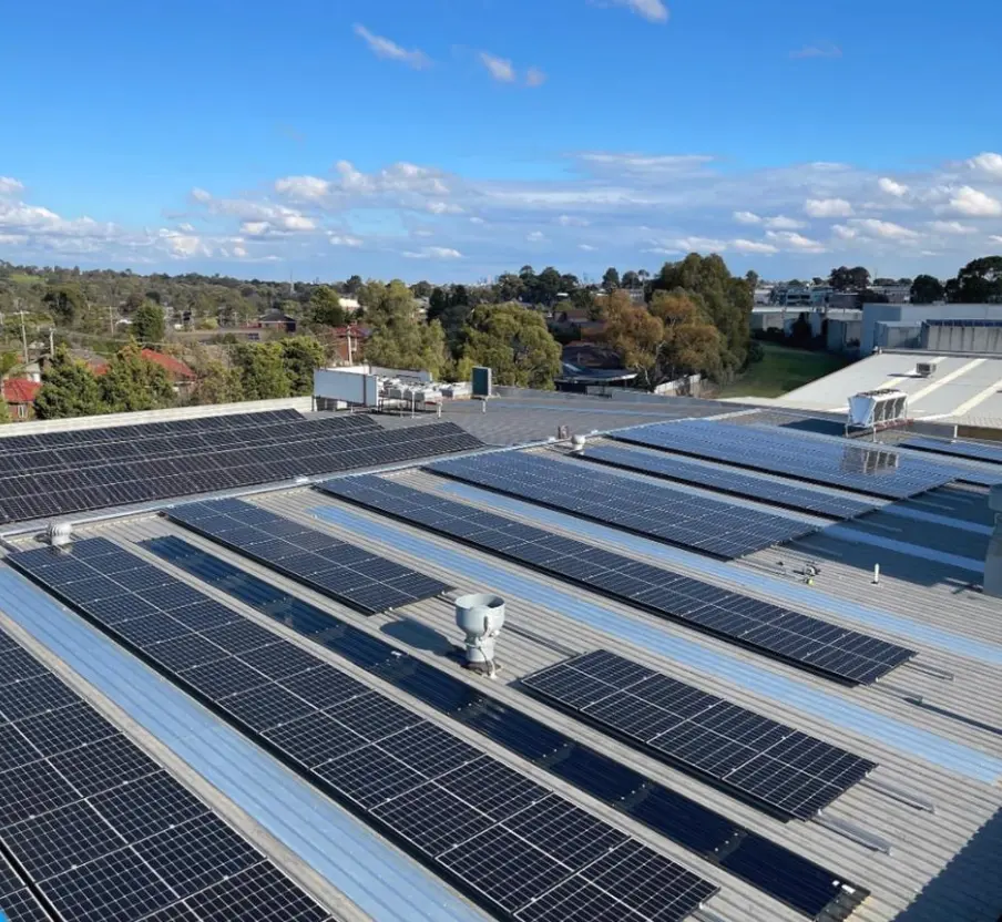 Extensive solar panel array on industrial rooftop